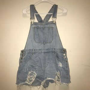 Distressed blue jean overalls